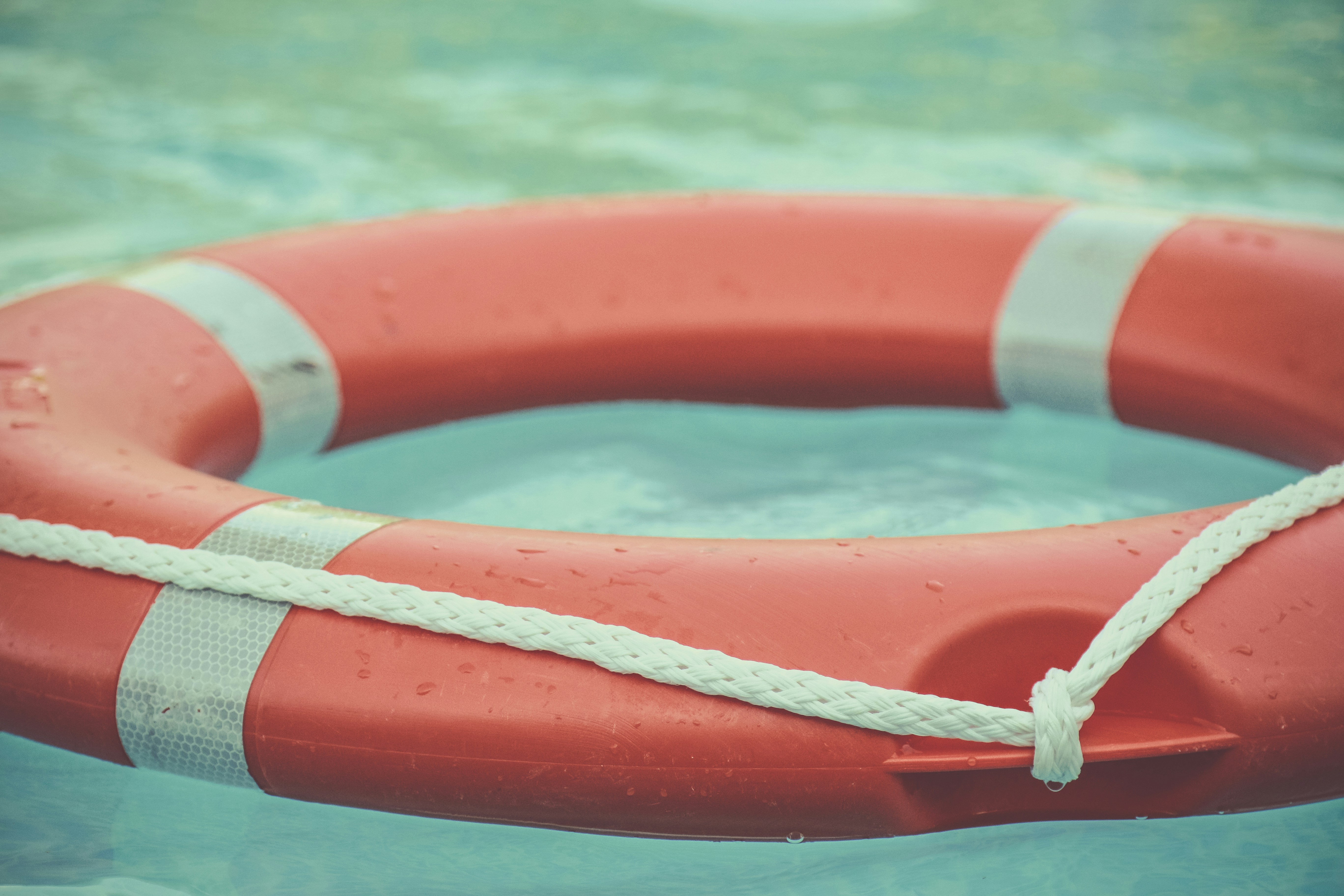 Life preserver ring floating in water